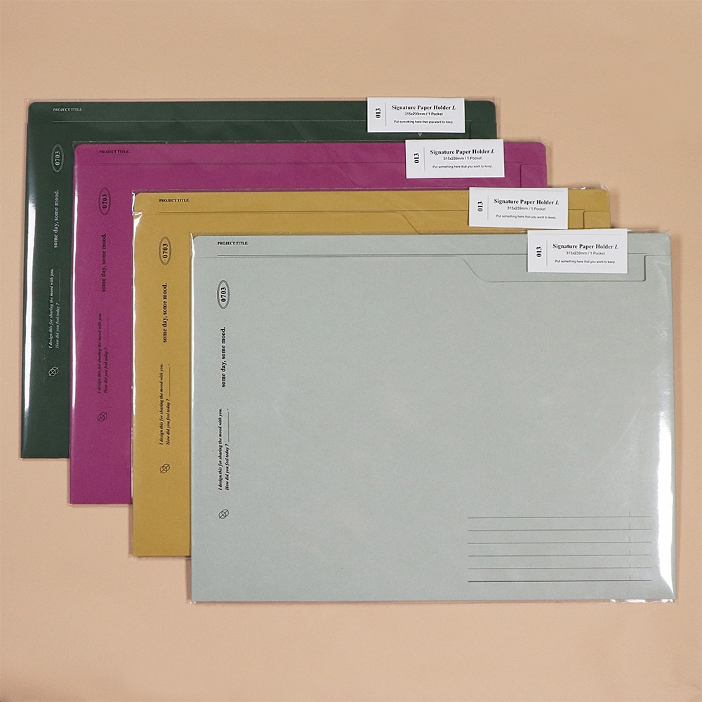 Kollektion des Signature Paperholder A4 in Grau, Oat, Purple, Green.